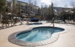 Outdoor pool and hot tubs located just behind the Slopeside condo.